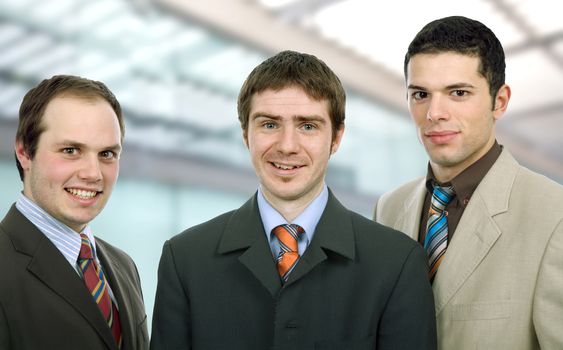 three happy business men together as a team