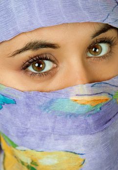 young woman with a veil, close up portrait, studio picture