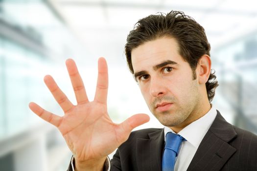 business man making stop with his hand, focus on the head