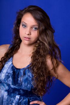 young beautiful woman, on a blue background