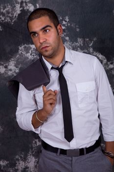 young business man, in front of a dark background