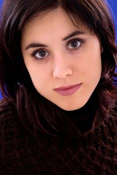 young beautiful woman, on a blue background