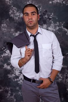 young business man, in front of a dark background