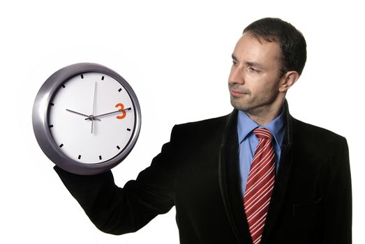 young handsome business man holding a clock