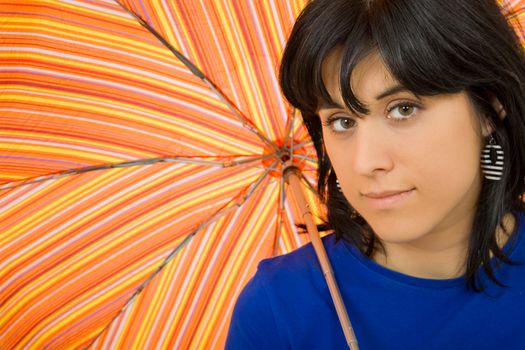 young brunette girl with a collored umbrella