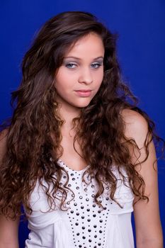 young beautiful woman, on a blue background