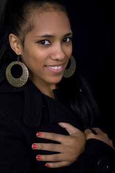 young beautiful woman close up portrait, on black background