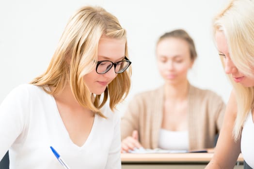 image of a young female students in the classroom, teaching at the University of