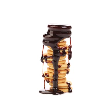 Chocolate dripping on cookies. Isolated on a white background.