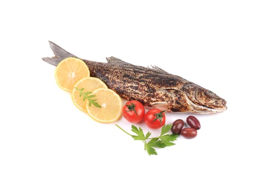 Grilled seabass and vegetables. Isolated on a white background.