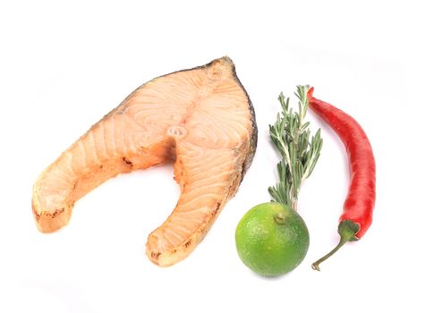 Fresh grilled salmon steak. Isolated on a white background.