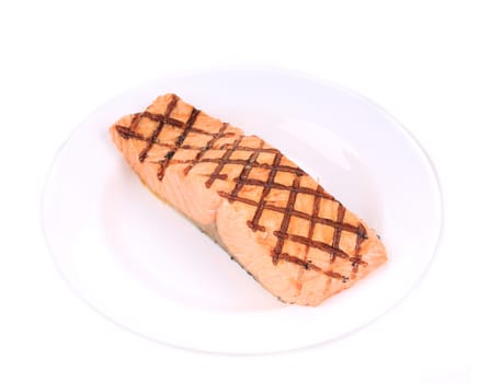 Fried salmon fillet on plate. Isolated on a white background.