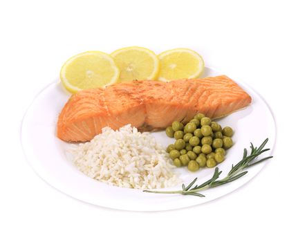 Grilled salmon filler with vegetables. Isolated on a white background.