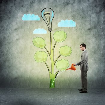 image of a businessman with a watering can