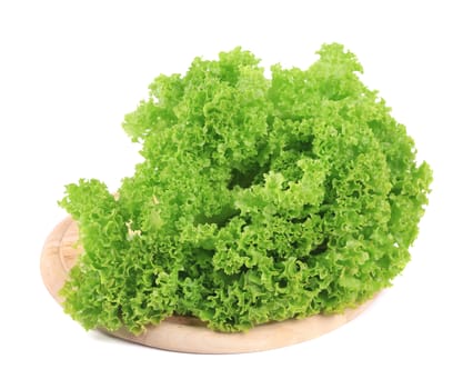 Fresh lettuce on wooden platter. Isolated on a white background.