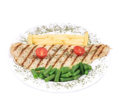 Pangasius fillet grilled with vegetables. Isolated on a white background.