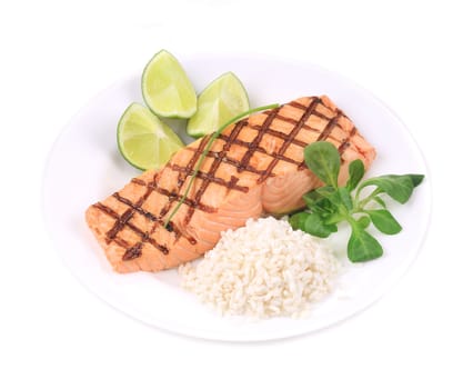 Roasted salmon fillets with rice. Isolated on a white background.