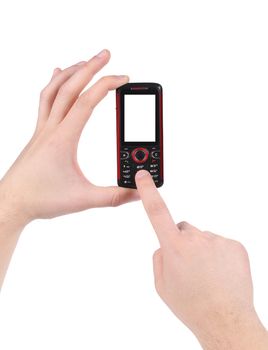 Hand holds red-black cell phone. Isolated on a white background.