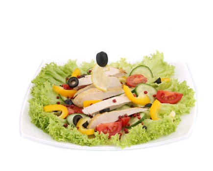 Chicken salad on a plate. Isolated on a white background.