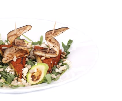 Salad with grilled vegetables and tofu. Whole background.