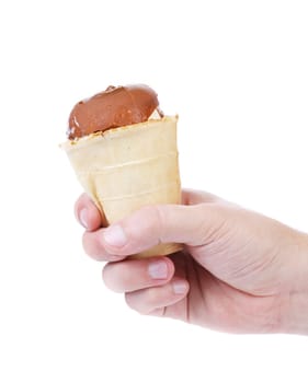 Hand holds waffle cup of chocolate ice cream. Isolated on a white background.