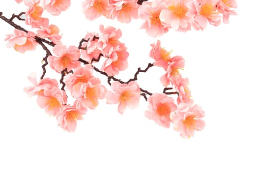 Branch of blooming artificial pink flowers. Whole background.