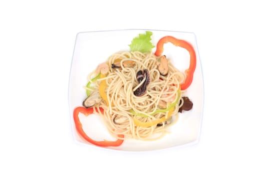 Seafood salad with spaghetti. Isolated on a white background.