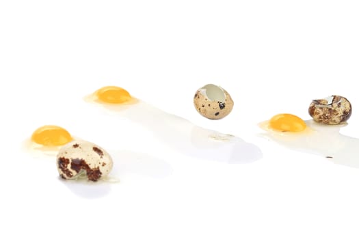 Broken quail eggs. Isolated on a white background.