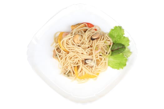 Seafood salad with spaghetti. Isolated on a white background.