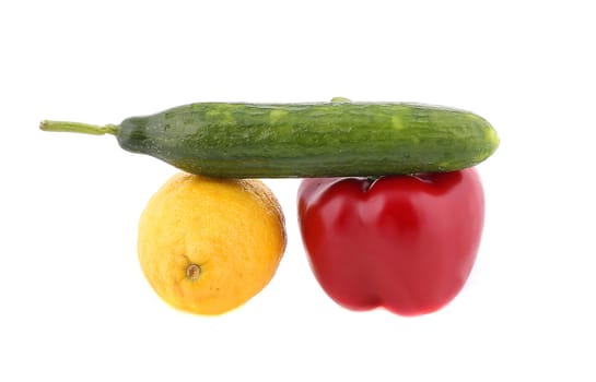 Colorful cucumber pepper and lemon. Isolated on a white background.