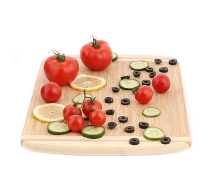 Composition of tomatoes and olives. Isolated on a white background.