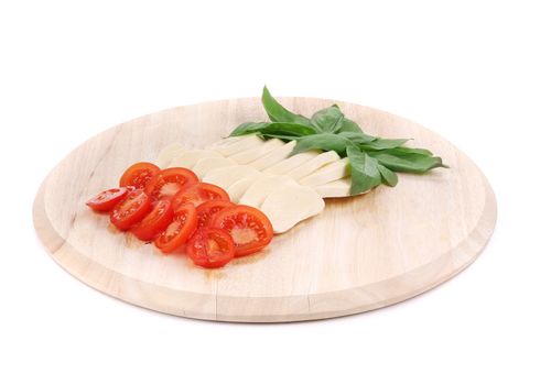 Caprese salad on platter. Isolated on a white background.