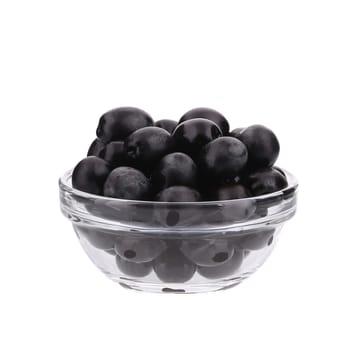 Black olives in a bowl. Isolated on a white background.
