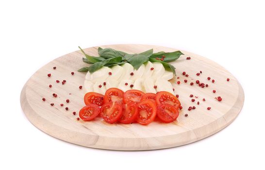 Caprese salad on platter. Isolated on a white background.