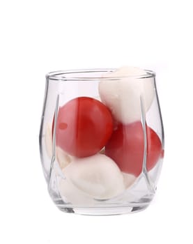 Glass of tomato and mozarella. Isolated on a white background.