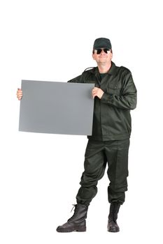 Man in workwear stands with paper. Isolated on a white background.