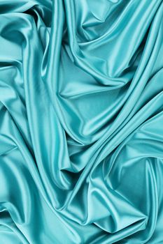 Aquamarine silk drapery. Close up. Whole background.