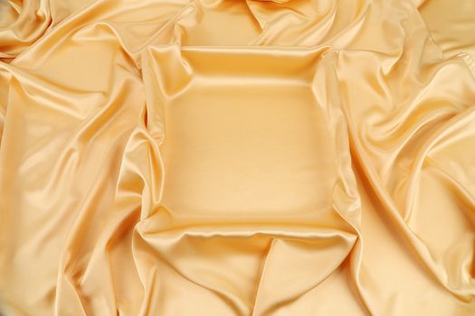 Gold silk drapery. Close up. Whole background.