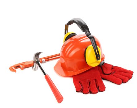 Red helmet and working tools. Isolated on a white background.