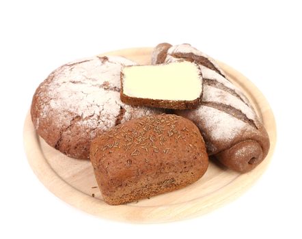 Fresh bread on platter. Isolated on a white background.