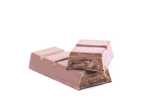 Bar of chocolate with a filling. Isolated on a white background.