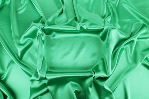 Green silk drapery. Close up. Whole background.