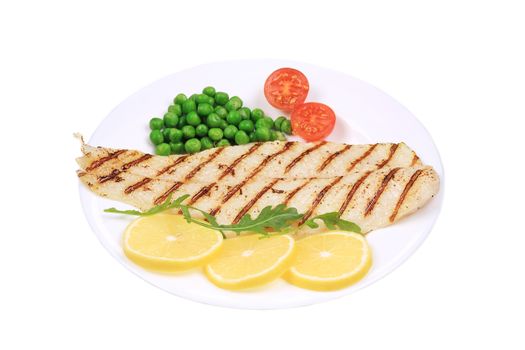 Fish fillet with vegetables. Isolated on a white background.