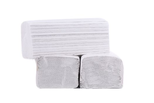 Stack of folded disposable papers. Isolated on a white background.