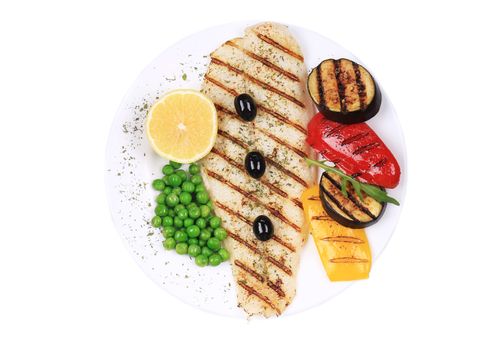 Grilled fish fillet with vegetables. Isolated on a white background.
