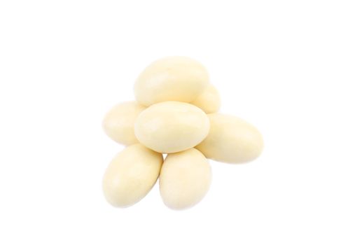 Pill of white chocolate dragee. Isolated on a white background.