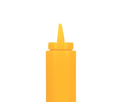 Yellow plastic container for sauce. Isolated on a white background.