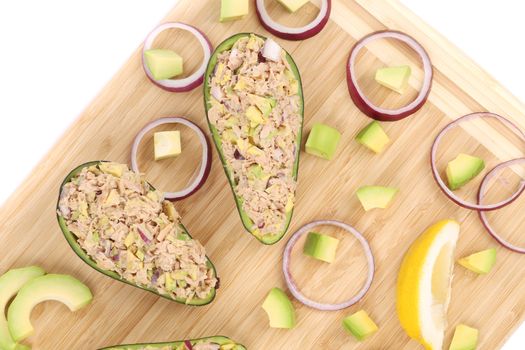 Avocado salad with tuna. Isolated on a white background.