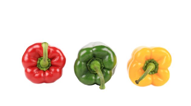 Three beautiful bell peppers. Isolated on a white background.