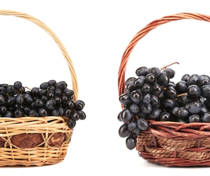 Two basket with red grape. Isolated on a white background.